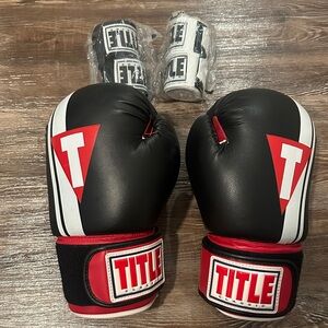Title boxing gloves and 2 sets of hand wraps!